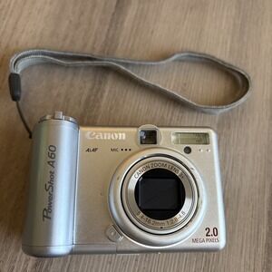Canon PowerShot A60 Camera 2 MP Silver Not Working For Parts Or Repair READ
